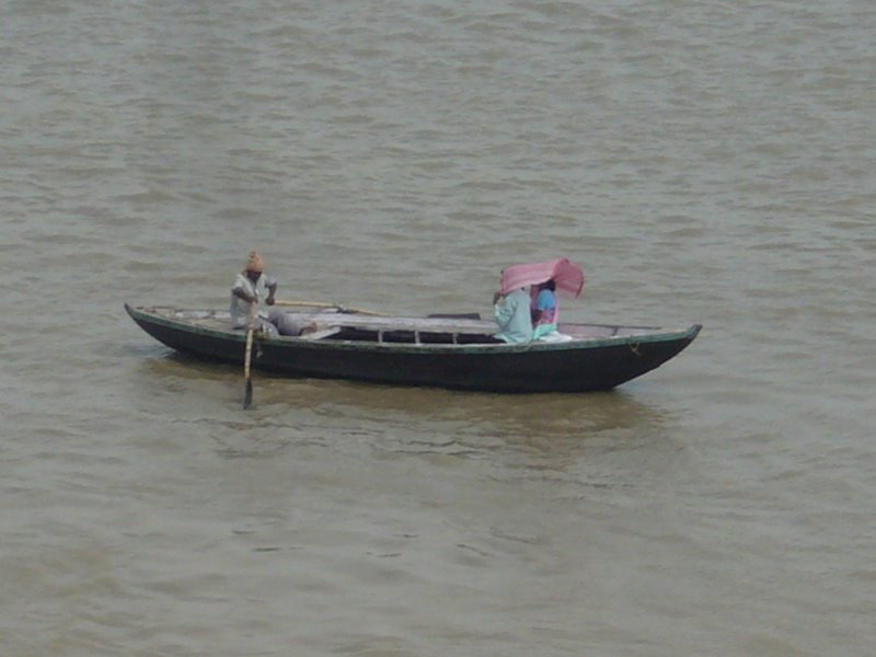 A couple on a holy boat ride along the gangees.