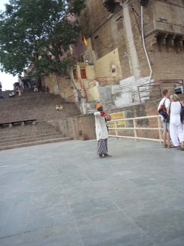 A begging musician. These would walk up to tourists and play in their ears until theygot a few rupees.