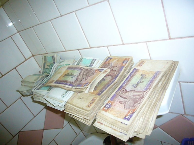 CASH. $100 can be exchanged on the black market for a briefcase full of Kyats (pronounced 'chass').