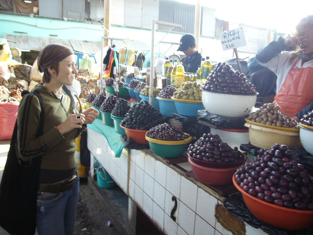 The covered market. Olive vendor.